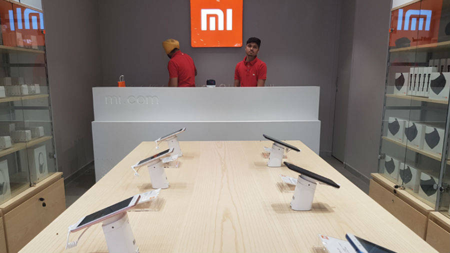 xiaomi hiding cover retail store branding with made in india logo anti china campaign fear